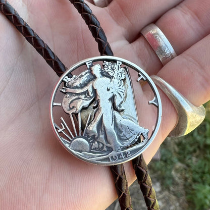 U.S. Walking Liberty Half Dollar Hand Cut Silver Coin Bolo Tie on a hand. - Mountainstruck Coin Jewelry