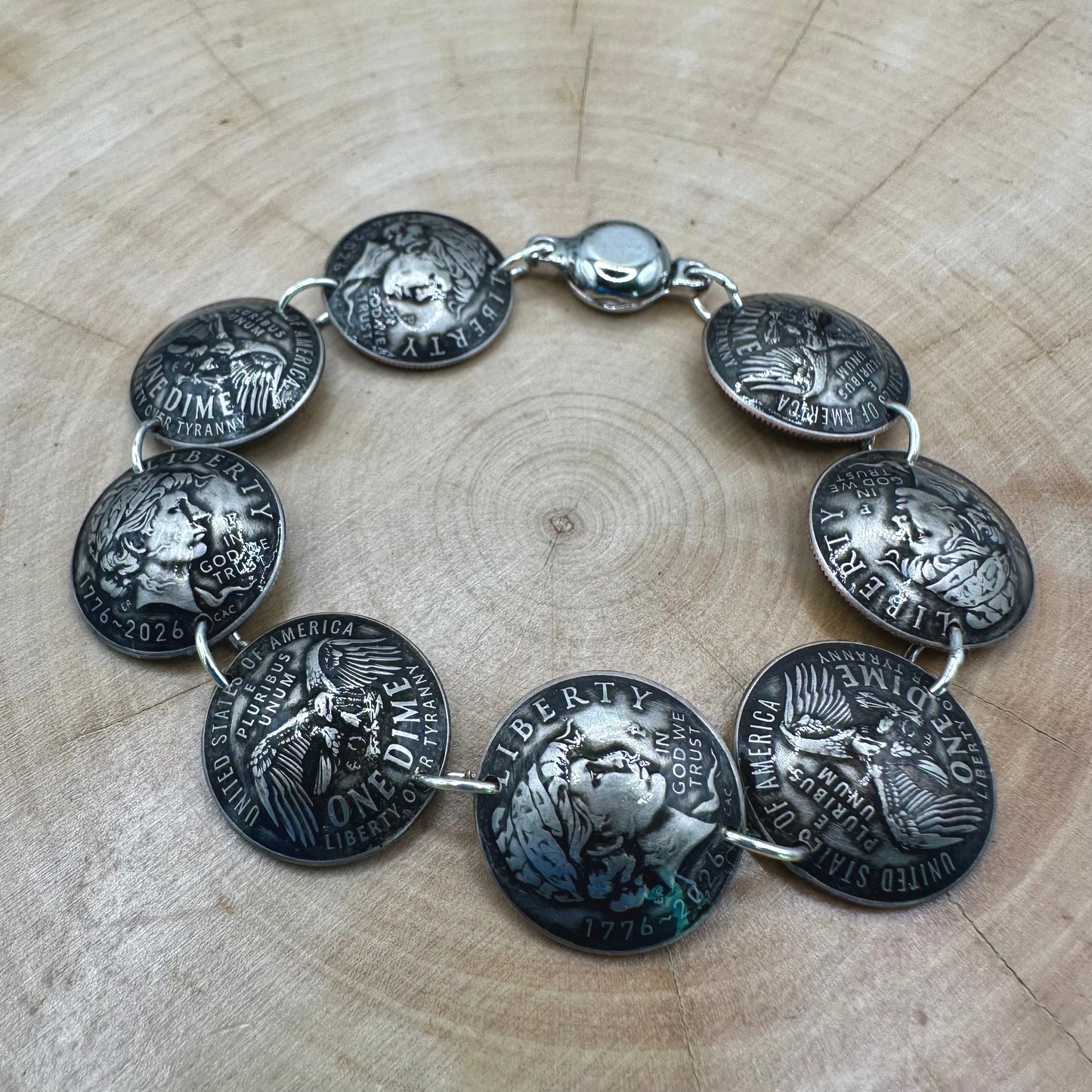 Handmade U.S. 2026 "Liberty" Dime Domed Coin Bracelet with magnetic clasp on a wood round. - Mountainstruck Coin Jewelry