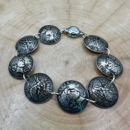 Handmade U.S. 2026 "Liberty" Dime Domed Coin Bracelet with magnetic clasp on a wood round. - Mountainstruck Coin Jewelry