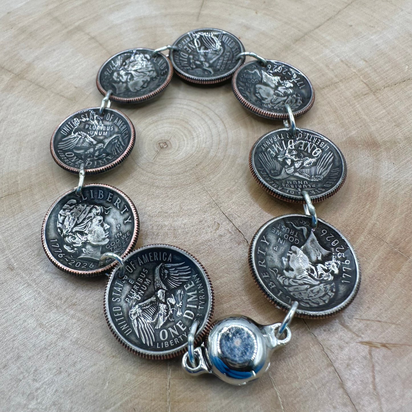 Handmade U.S. 2026 "Liberty" Dime Domed Coin Bracelet with magnetic clasp on a wood round. - Mountainstruck Coin Jewelry