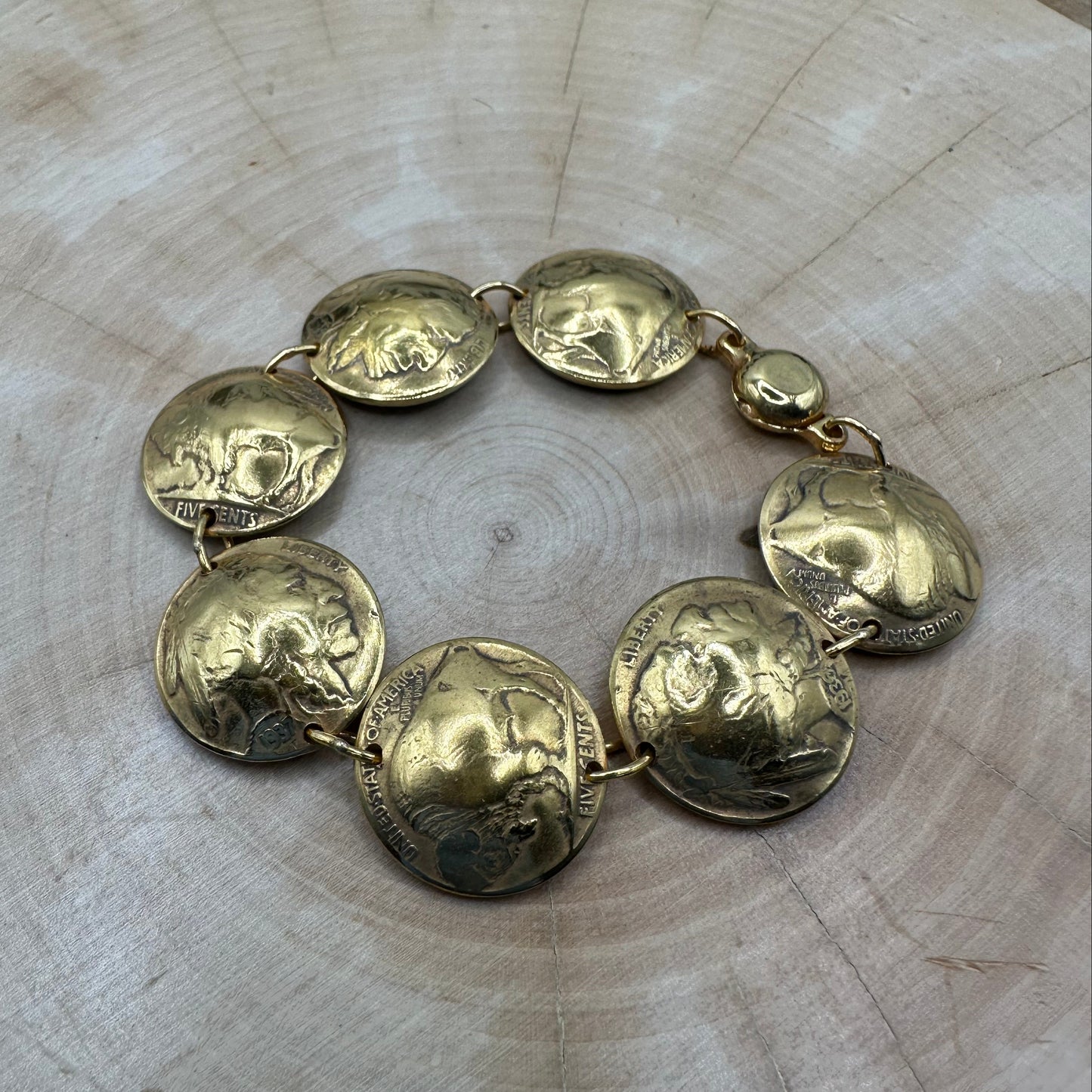 U.S. Buffalo Nickel Domed Coin Bracelet 24k gold plated on a light wood round. - Mountainstruck Coin Jewelry