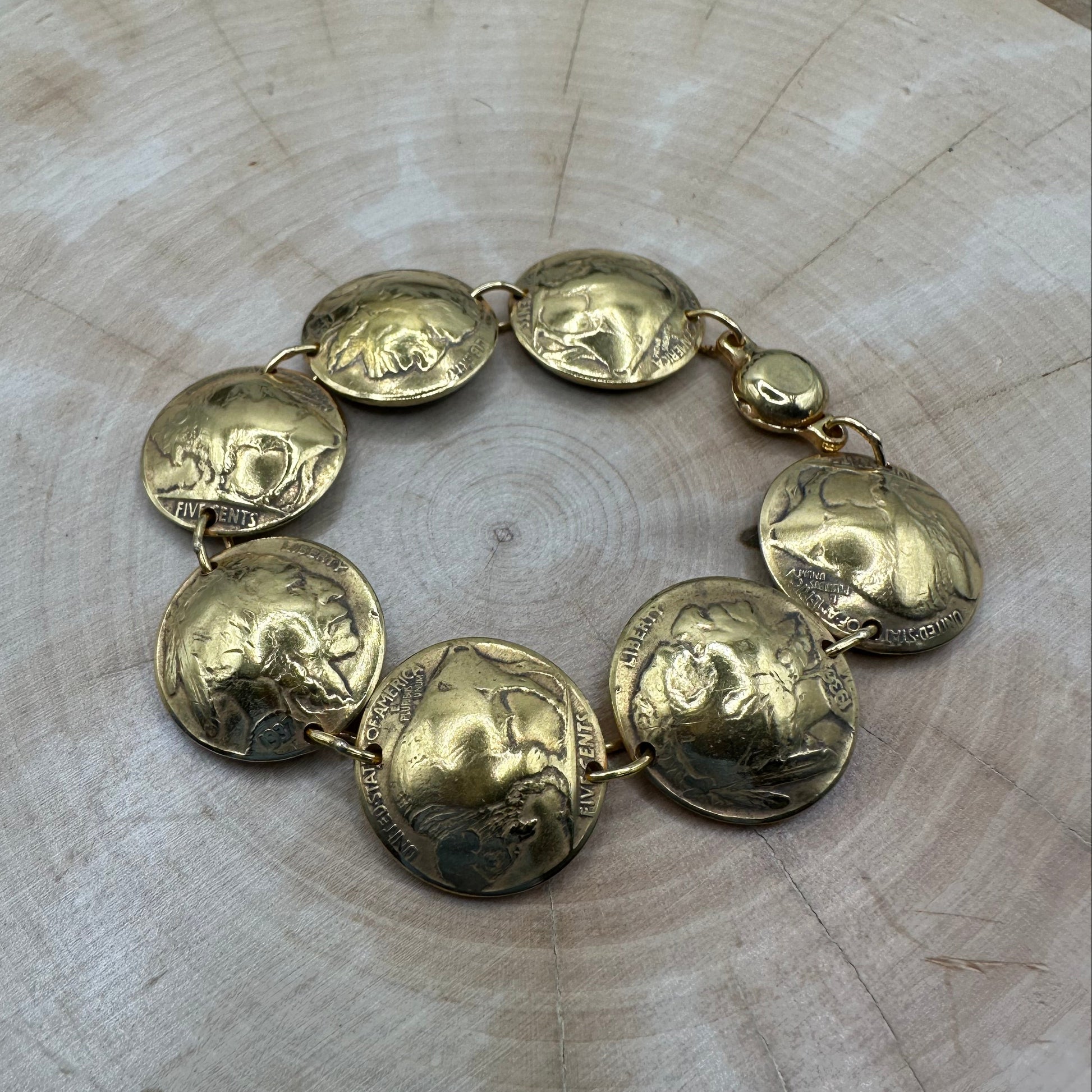 U.S. Buffalo Nickel Domed Coin Bracelet 24k gold plated on a light wood round. - Mountainstruck Coin Jewelry