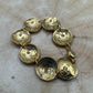 U.S. Buffalo Nickel Domed Coin Bracelet 24k gold plated on a light wood round. - Mountainstruck Coin Jewelry