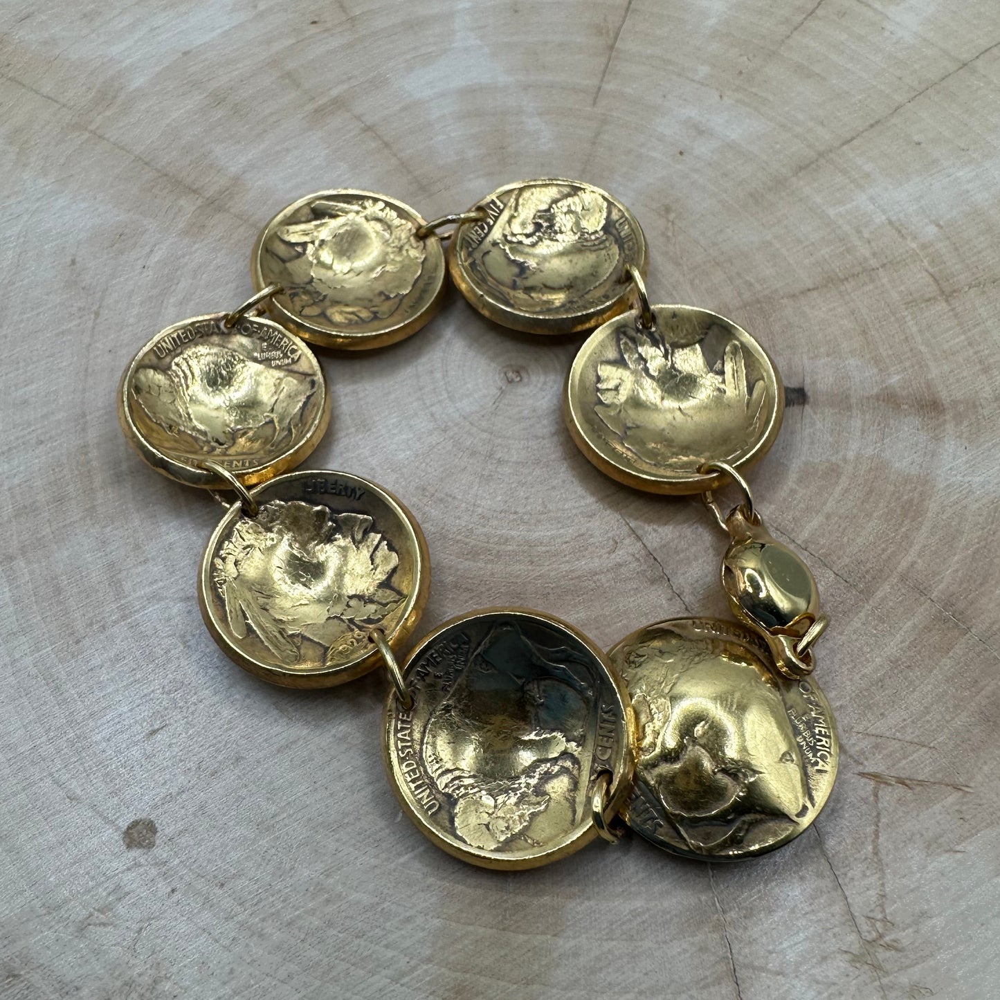 U.S. Buffalo Nickel Domed Coin Bracelet 24k gold plated on a light wood round. - Mountainstruck Coin Jewelry