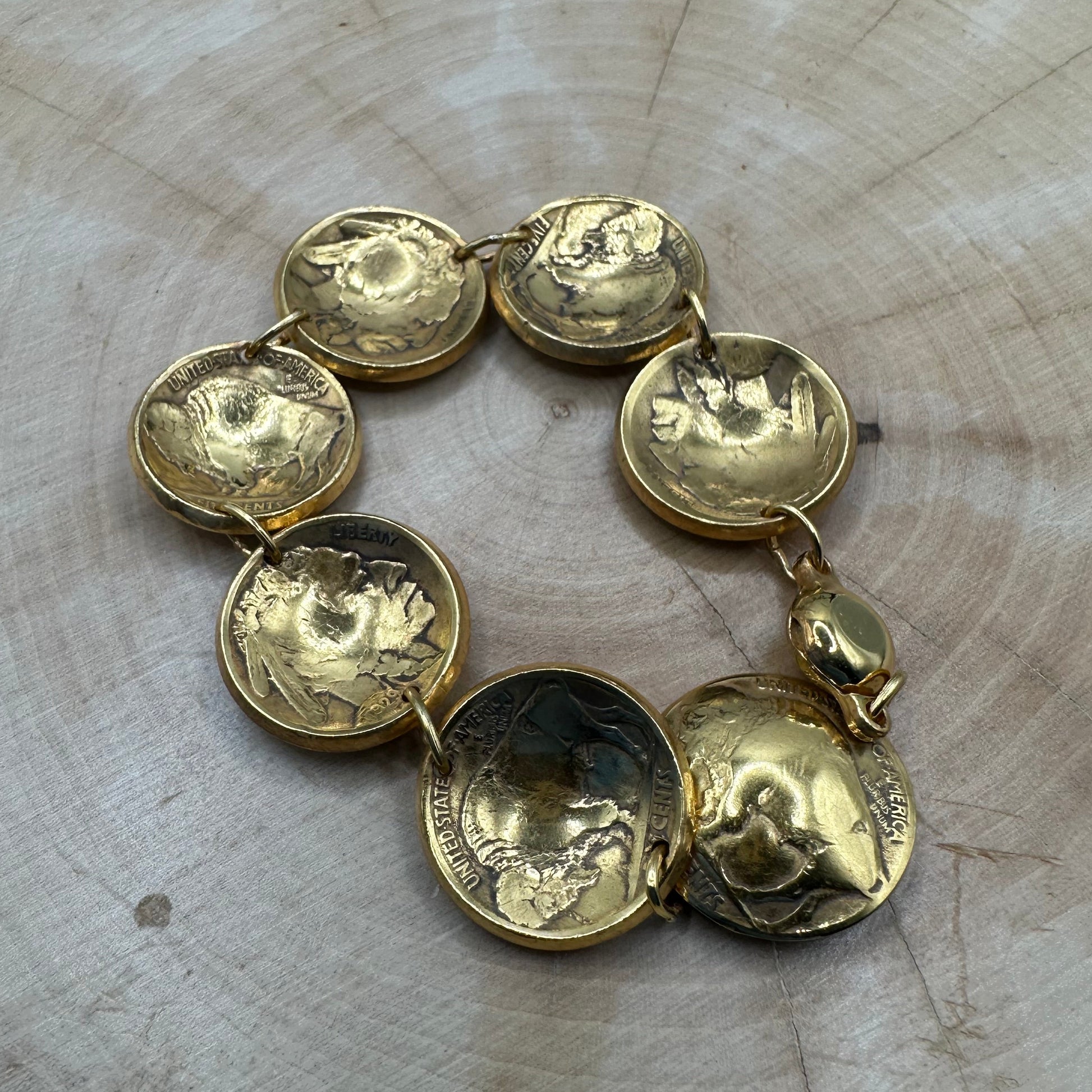 U.S. Buffalo Nickel Domed Coin Bracelet 24k gold plated on a light wood round. - Mountainstruck Coin Jewelry