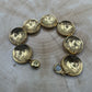 U.S. Buffalo Nickel Domed Coin Bracelet 24k gold plated on a light wood round. - Mountainstruck Coin Jewelry