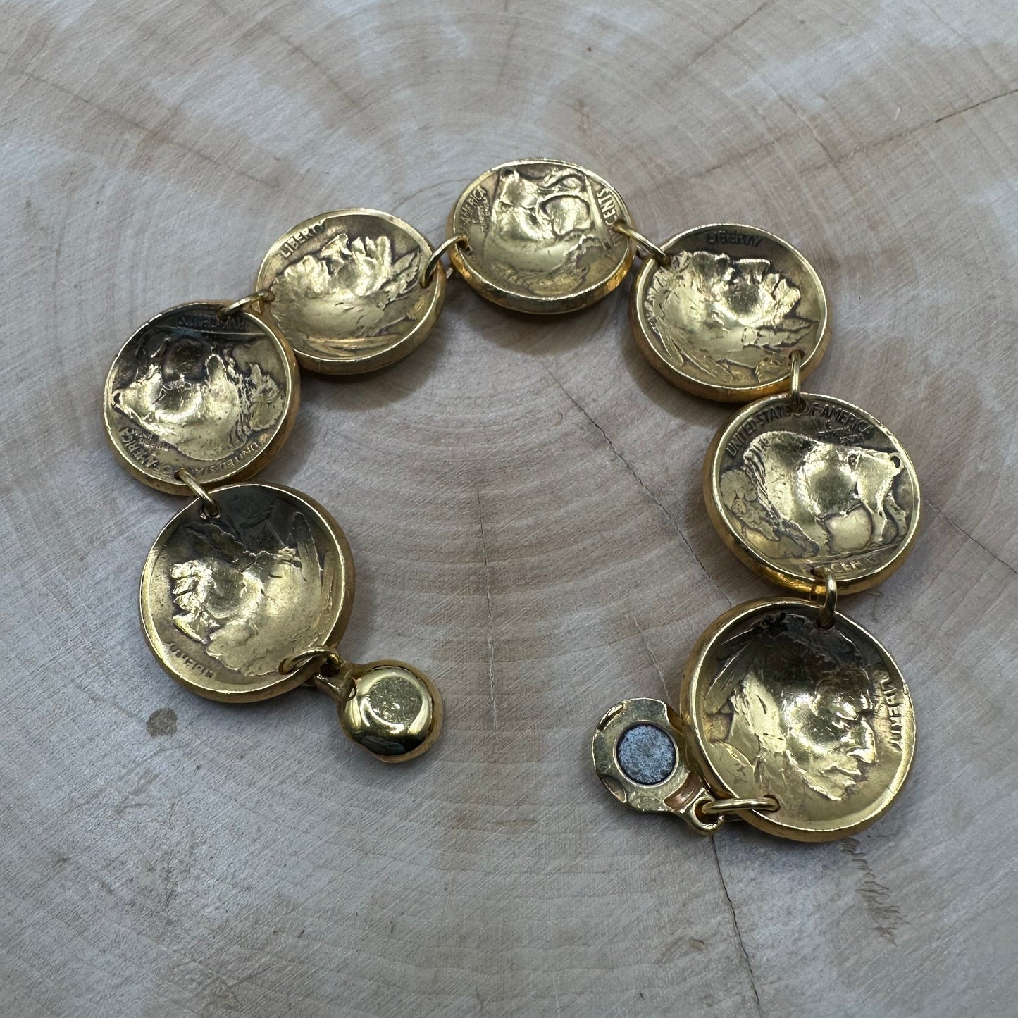 U.S. Buffalo Nickel Domed Coin Bracelet 24k gold plated on a light wood round. - Mountainstruck Coin Jewelry