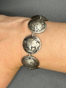 U.S. Buffalo Nickel Domed Coin Bracelet on a wrist in front of a black background. - Mountainstruck Coin Jewelry