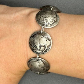 U.S. Buffalo Nickel Domed Coin Bracelet on a wrist in front of a black background. - Mountainstruck Coin Jewelry