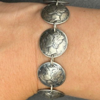 U.S. Mercury Dime Silver Coin Bracelet on a wrist on a black background. - Mountainstruck Coin Jewelry