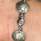 U.S. Mercury Dime Silver Coin Bracelet on a wrist showing magnetic clasp on a black background. - Mountainstruck Coin Jewelry