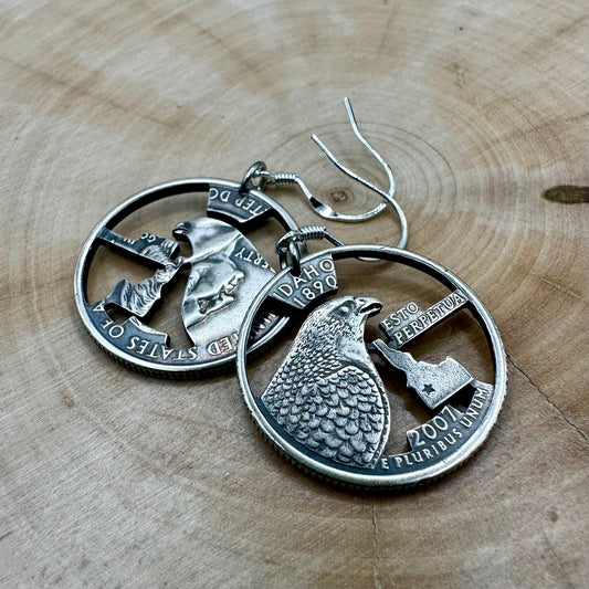 U.S. State Quarter Hand Cut Coin Earrings on a wood background. - Mountainstruck Coin Jewelry