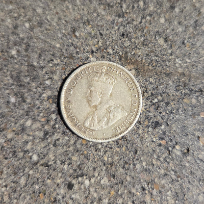 Australia emu kangaroo 6 pence silver coin front on concrete background- Mountainstruck Coin Jewelry