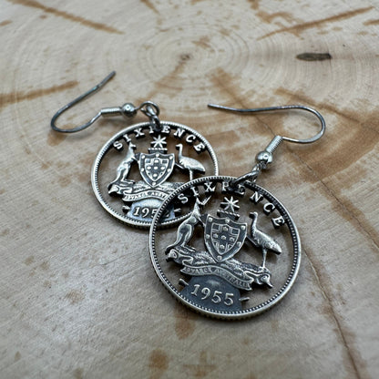 Australia Emu & Kangaroo Hand Cut Silver Coin Earrings on a wood background. - Mountainstruck Coin Jewelry