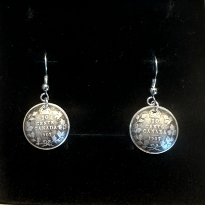 Canada 10 Cents Silver Domed Earrings in a brown kraft box on a black velvet background. - Mountainstruck Coin Jewelry