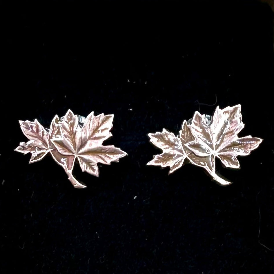 Canada Maple Leaf Penny Stud Coin Earrings on a black velvet background. 
- Mountainstruck Coin Jewelry
