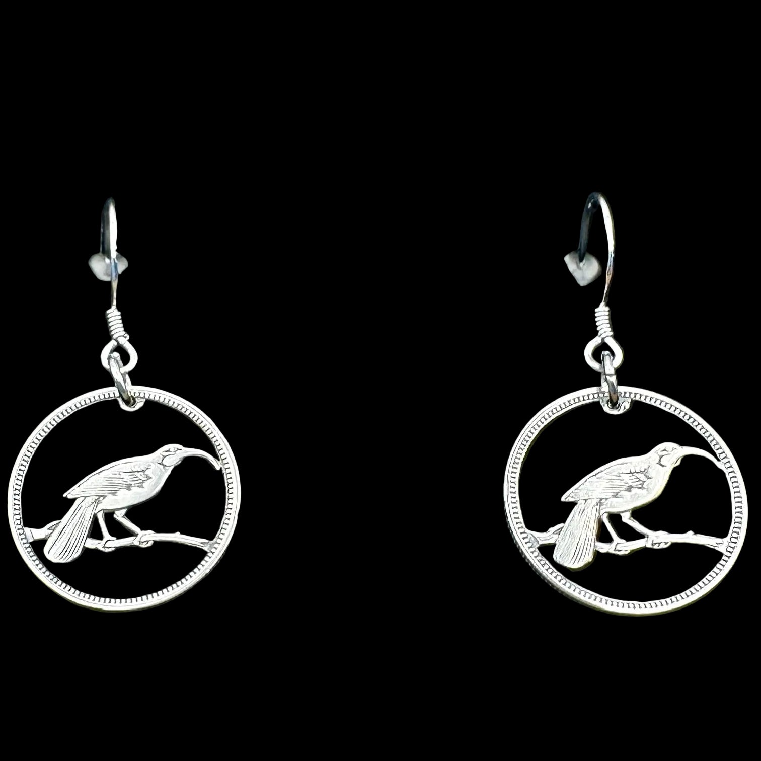 New Zealand Huia Bird 6 Pence Silver Hand Cut Coin Earrings on a black velvet background. - Mountainstruck Coin Jewelry