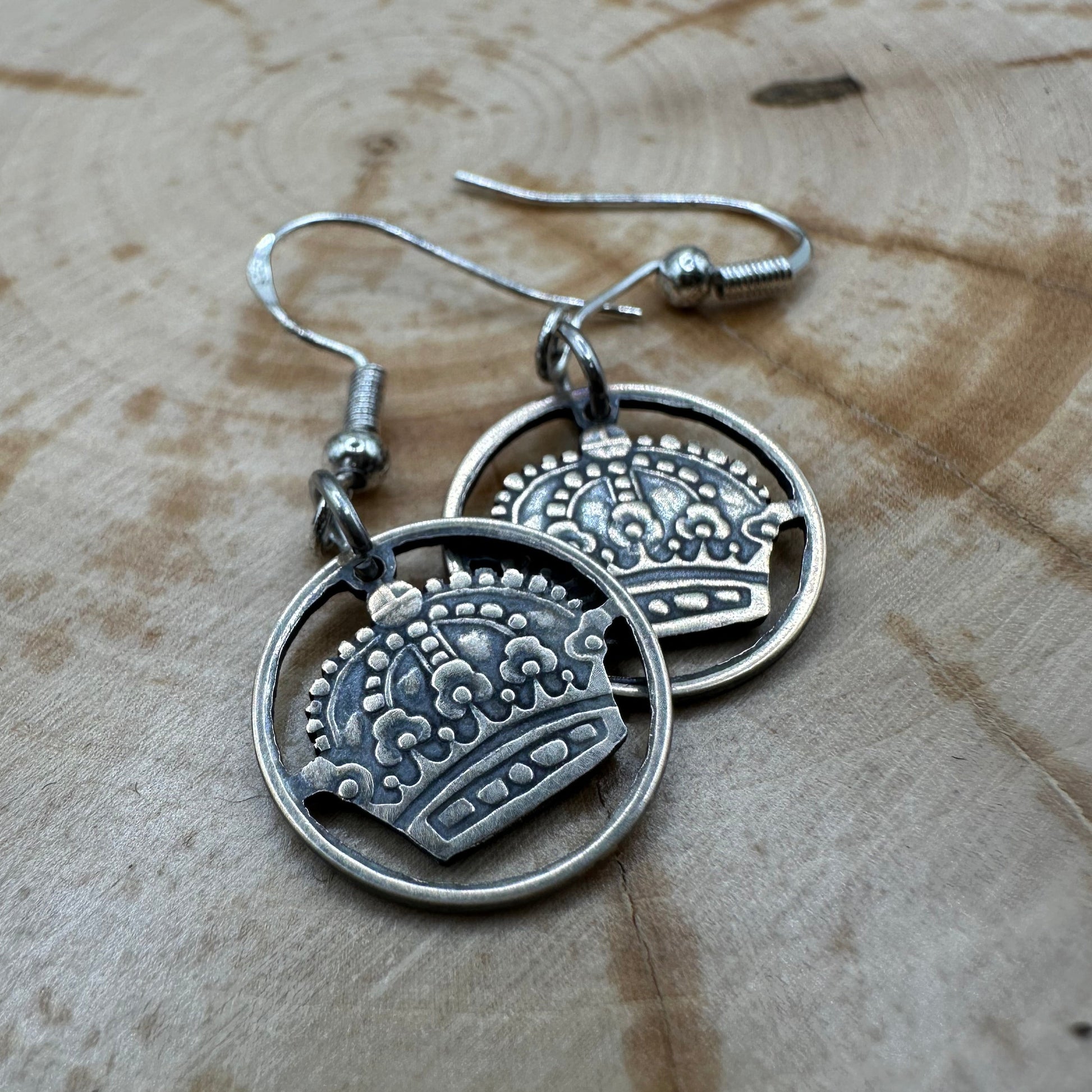 Sweden Crown 10 Ore Hand Cut Silver Coin Earrings on a wood background. - Mountainstruck Coin Jewelry