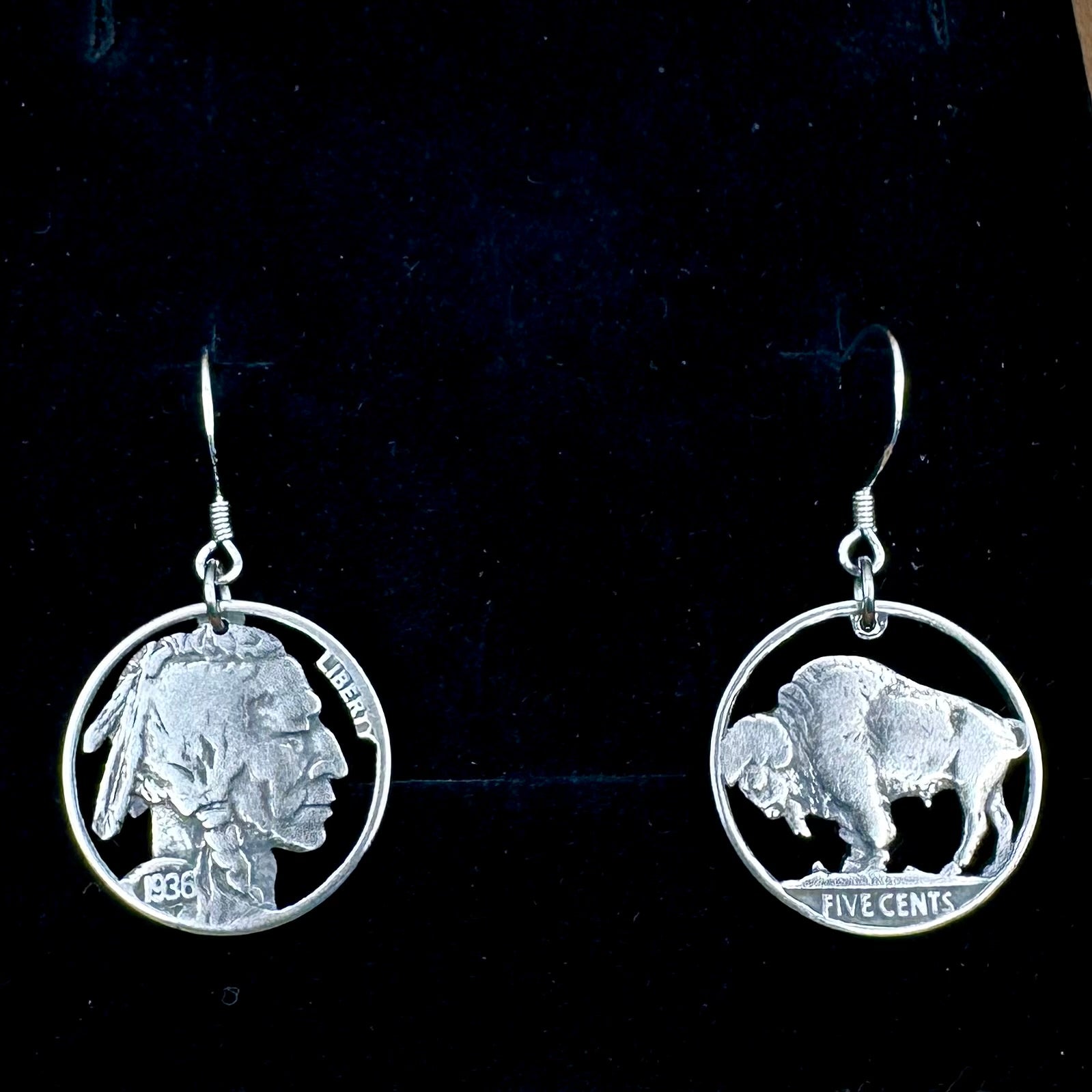U.S. Buffalo Nickel Hand Cut Coin Earrings (combo) with sterling silver earring hooks on a black velvet background. - Mountainstruck Coin Jewelry