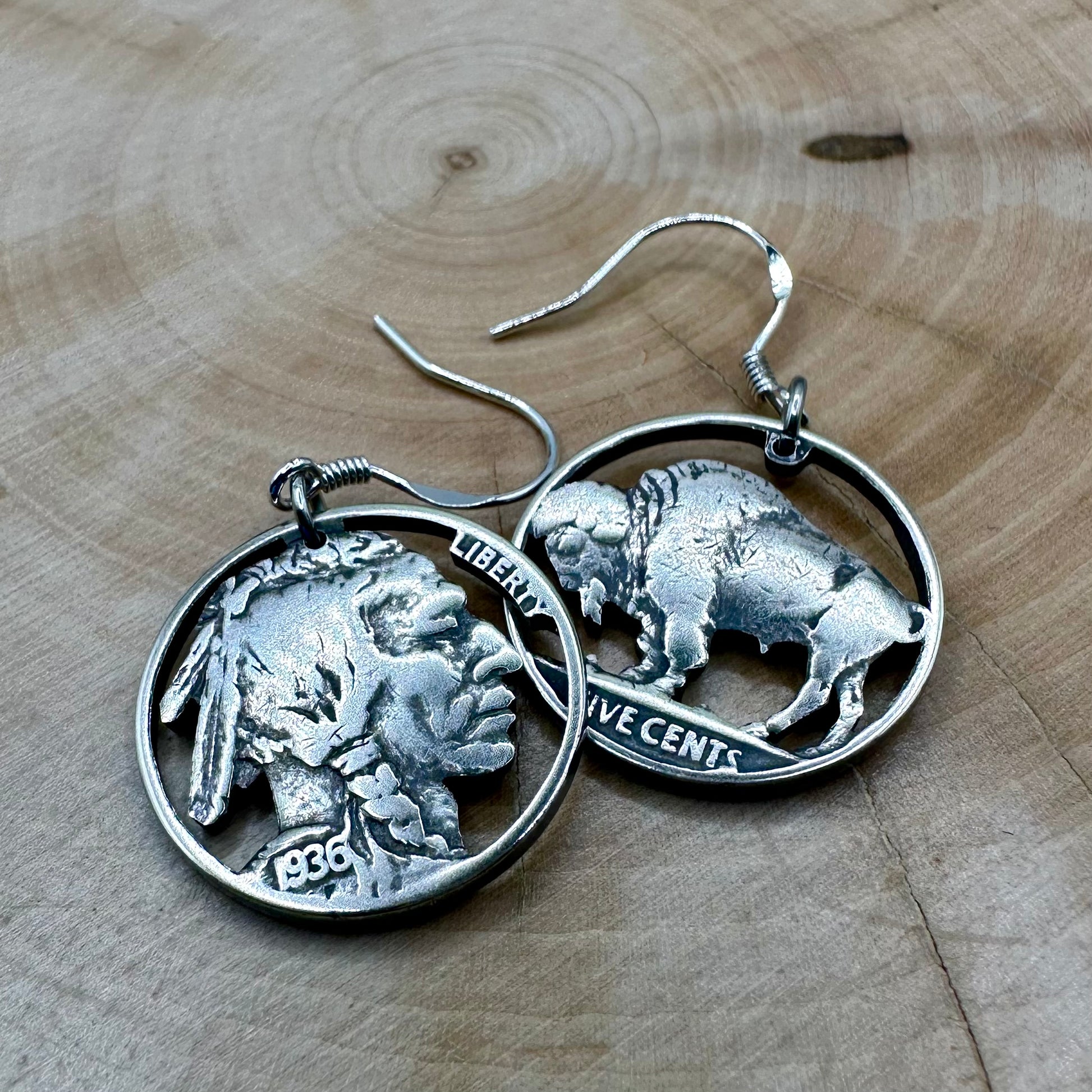 U.S. Buffalo Nickel Hand Cut Coin Earrings (combo) with sterling silver earring hooks on a wood background. - Mountainstruck Coin Jewelry