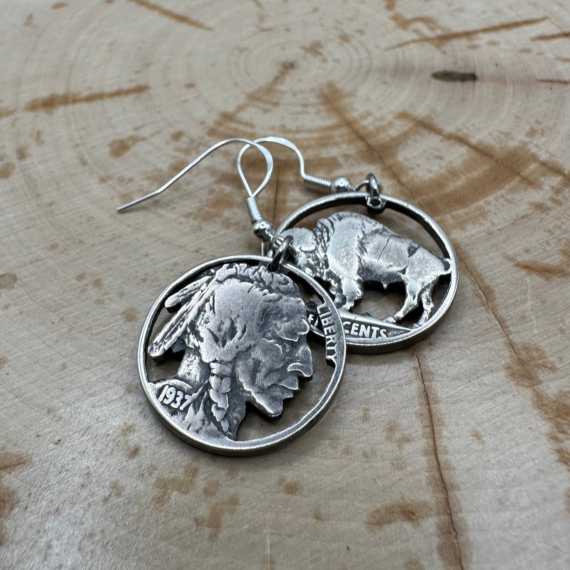 U.S. Buffalo Nickel Hand Cut Coin Earrings (combo) with sterling silver earring hooks on a wood background. - Mountainstruck Coin Jewelry