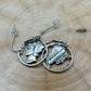 U.S. Mercury Dime Silver Hand Cut Coin Earrings on a light wood round. - Mountainstruck Coin Jewelry