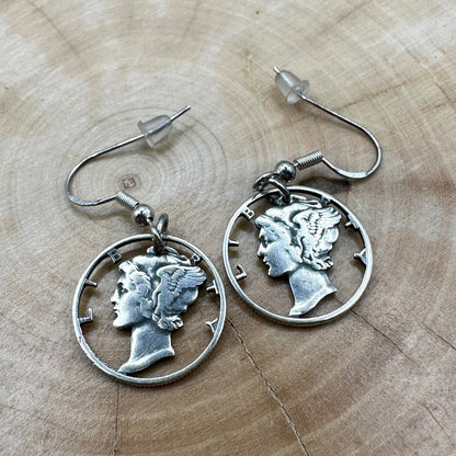 U.S. Mercury Dime Silver Hand Cut Coin Earrings on a light wood round. - Mountainstruck Coin Jewelry