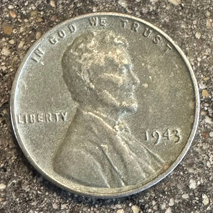 U.S. Steel Wheat Penny coin front on a concrete background. 
- Mountainstruck Coin Jewelry