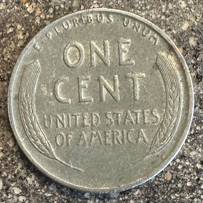 U.S. Steel Wheat Penny coin back on a concrete background. 
- Mountainstruck Coin Jewelry