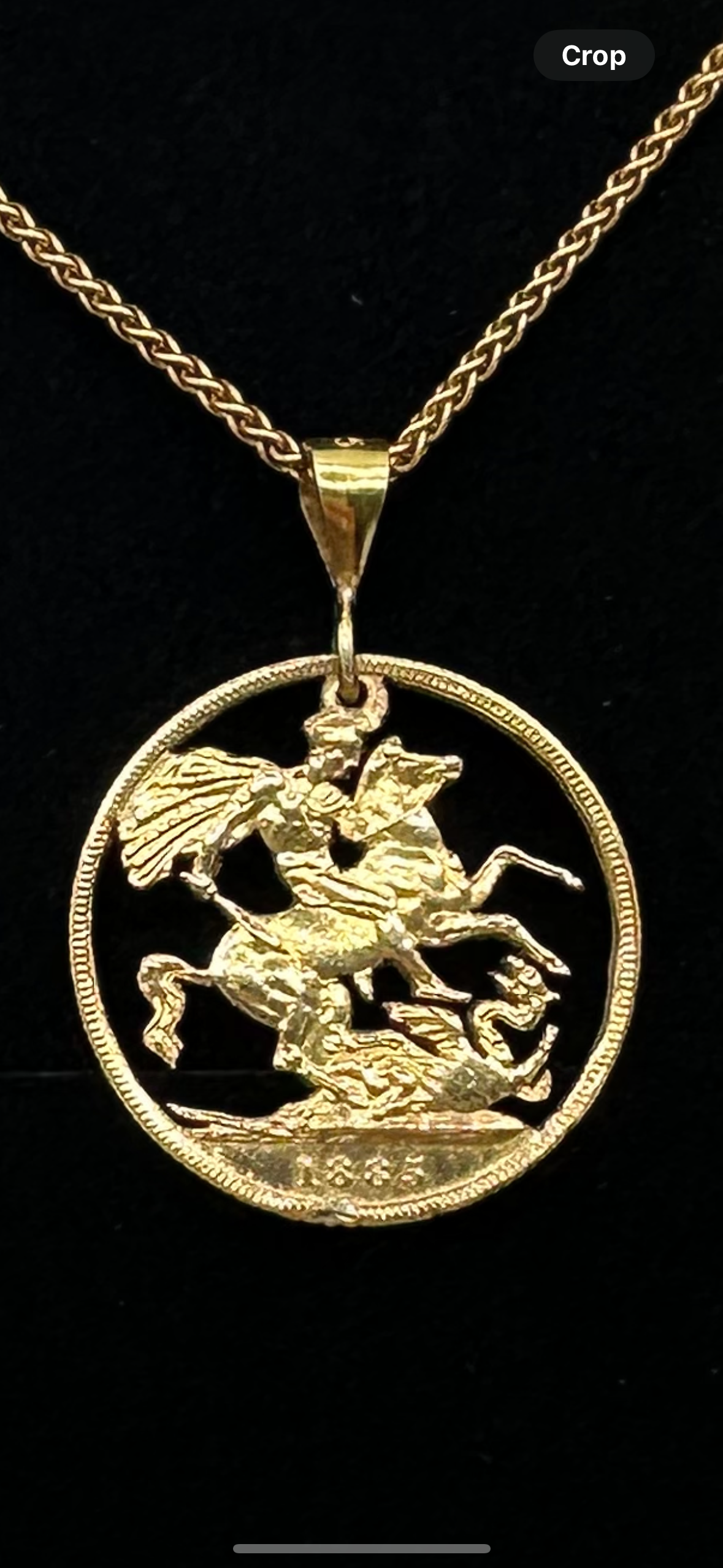 22k Solid Gold UK Gold Sovereign hand cut coin necklace on a black velvet background. - Mountainstruck Coin Jewelry
