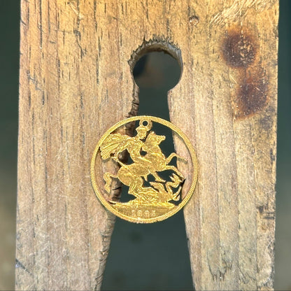 22k Solid Gold UK Gold Sovereign hand cut coin necklace on a wood background. - Mountainstruck Coin Jewelry