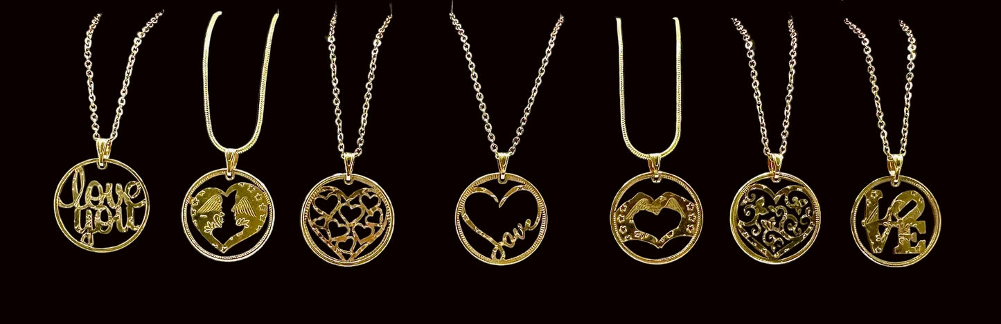 24k Gold Plated Heart Token Necklaces with various designs on a black background. - Mountainstruck Coin Jewelry