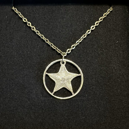 Bahamas 1 Cent Starfish hand cut coin necklace on a black velvet background. - Mountainstruck Coin Jewelry