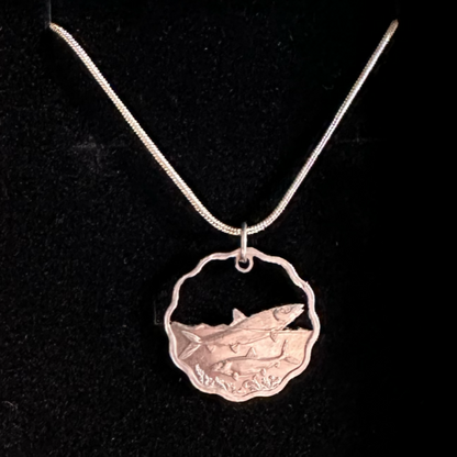 Bahamas 10 Cents Fish Hand Cut Coin Necklace on black velvet background. - Mountainstruck Coin Jewelry