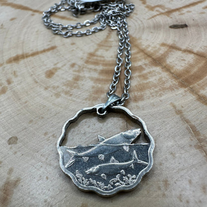 Bahamas 10 Cents Fish Hand Cut Coin Necklace on wood background. - Mountainstruck Coin Jewelry