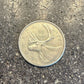 Caribou Canada Silver 25 Cent Coin back on a concrete background. - Mountainstruck Coin Jewelry