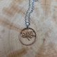 Canada Maple Leaf Penny Hand Cut Coin Necklace on a wood background. - Mountainstruck Coin Jewelry