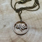 Canada Maple Leaf Penny Hand Cut Coin Necklace with bronze chain on a light wood round. - Mountainstruck Coin Jewelry