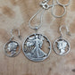 U.S. Lady Liberty Hand Cut Silver Coin Collection (snake chain) on a wood background- Mountainstruck Coin Jewelry