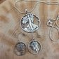 U.S. Lady Liberty Hand Cut Silver Coin Collection (snake chain) on a wood background- Mountainstruck Coin Jewelry