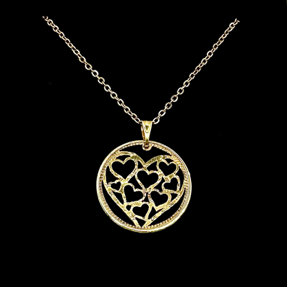 Gold Plated Heart of Hearts Hand Cut Token Necklace on a black velvet background. - Mountainstruck Coin Jewelry