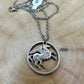 Greece Pegasus 5 Drachmai Hand Cut Coin Necklace with a stainless chain on a wood background. - Mountainstruck Coin Jewelry