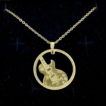 Guitar Hand Cut Token Necklace on a black velvet background. - Mountainstruck Coin Jewelry