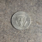 U.S. Half Dollar coin back on a concrete background. - Mountainstruck Coin Jewelry