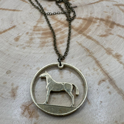 Ireland Horse 20 Pence Hand Cut Coin Necklace on wood background. - Mountainstruck Coin Jewelry