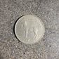 Ireland Red Deer Coin back on a concrete background. - Mountainstruck Coin Jewelry