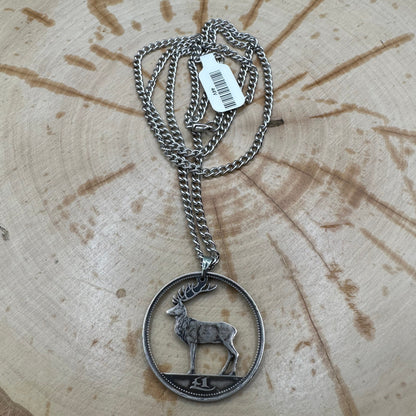 Irish Red Deer Hand Cut Coin Necklace on a black velvet background. - Mountainstruck Coin Jewelry
