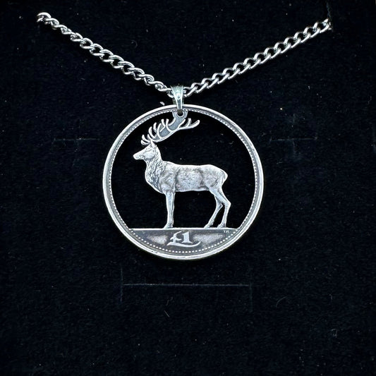 Irish Red Deer Hand Cut Coin Necklace on a black velvet background. - Mountainstruck Coin Jewelry
