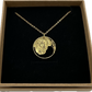 Honeybee Italy 10 Centesimi Hand Cut Coin Necklace in a brown kraft box on a black velvet background. - Mountainstruck Coin Jewelry