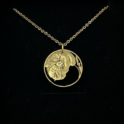 Honeybee Italy 10 Centesimi Hand Cut Coin Necklace on a black velvet background. - Mountainstruck Coin Jewelry